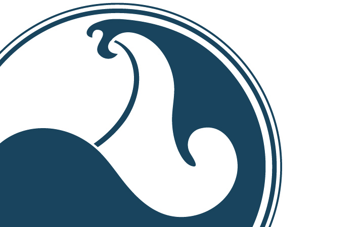 Close up of the Sacred Surf Logo